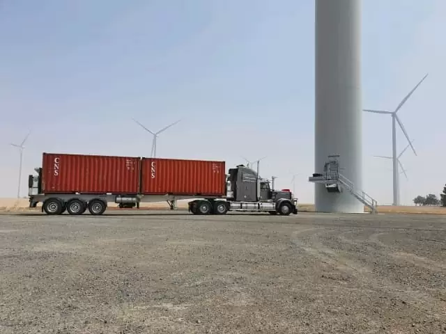 Shipping container transport all over with sideloader